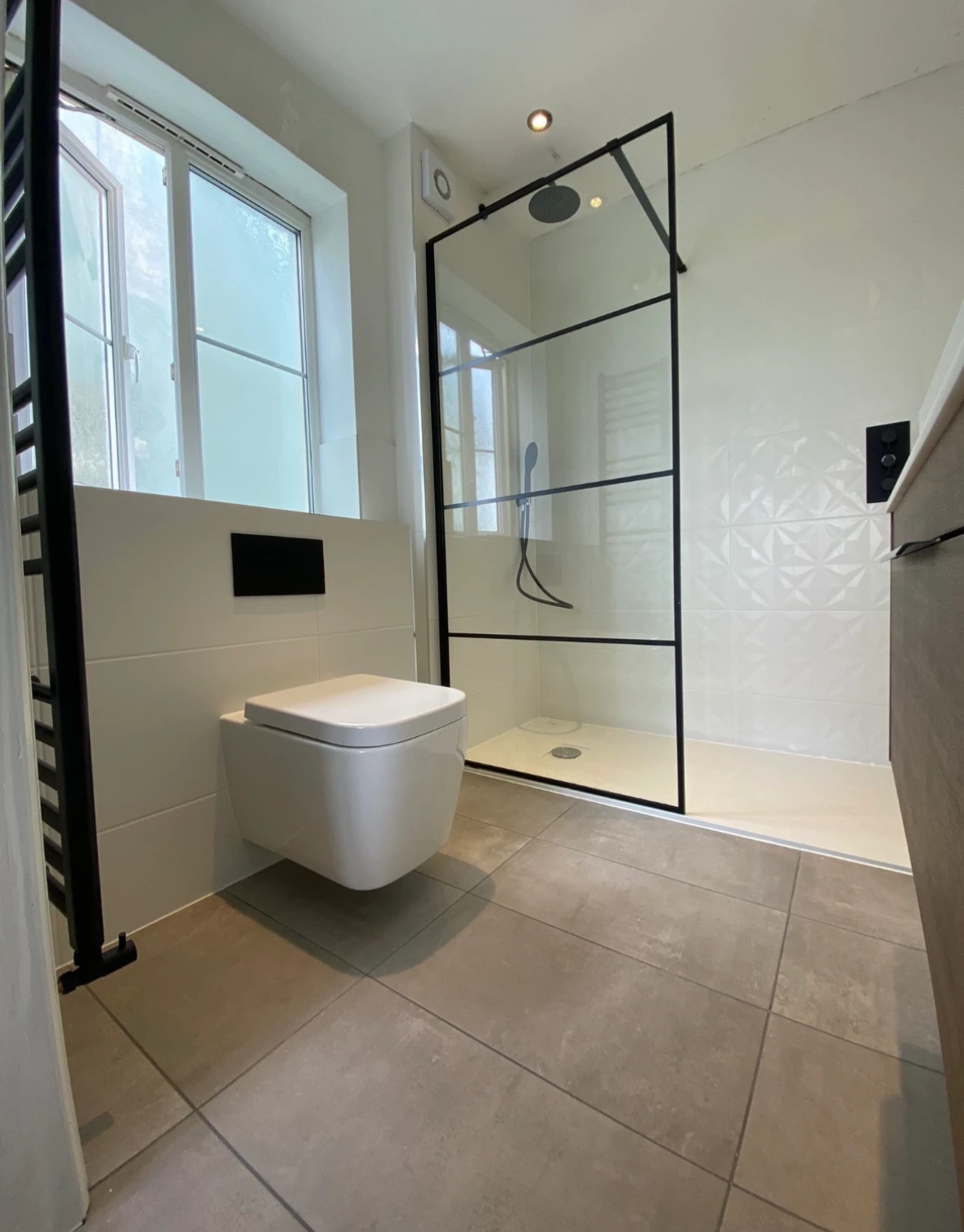 Completed bathroom with walk-in shower